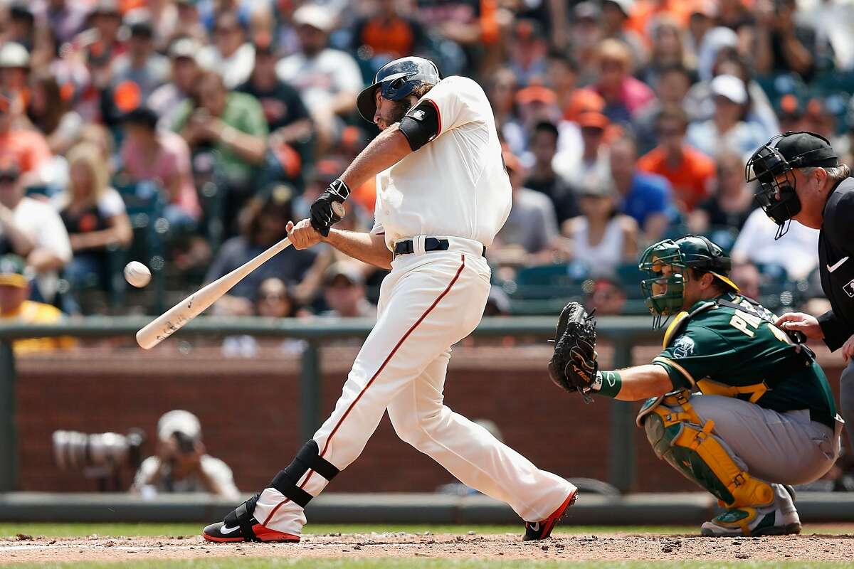 SAN FRANCISCO, CA - JULY 25: Madison Bumgarner #40 of the San Francisco Giants hits a solo home run in the third inning against the Oakland Athletics at AT&T Park on July 25, 2015 in San Francisco, California. (Photo by Lachlan Cunningham/Getty Images)