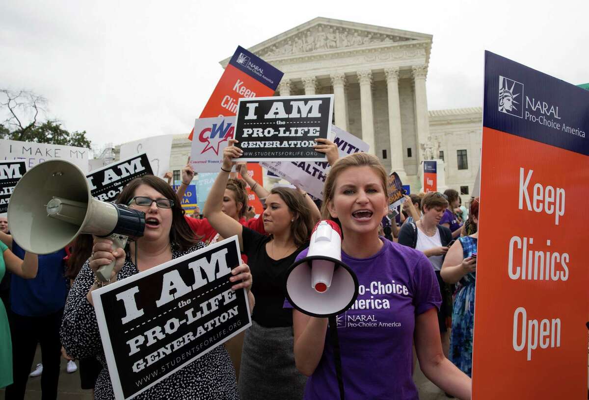 Pro-abortion rights and anti-abortion protesters rally in front of the U.S. Supreme Court in Washington, June 23, 2016. The protesters were hoping for a decision by the court in a major abortion case, Whole Woman’s Health v. Hellerstedt. (Stephen Crowley/The New York Times)