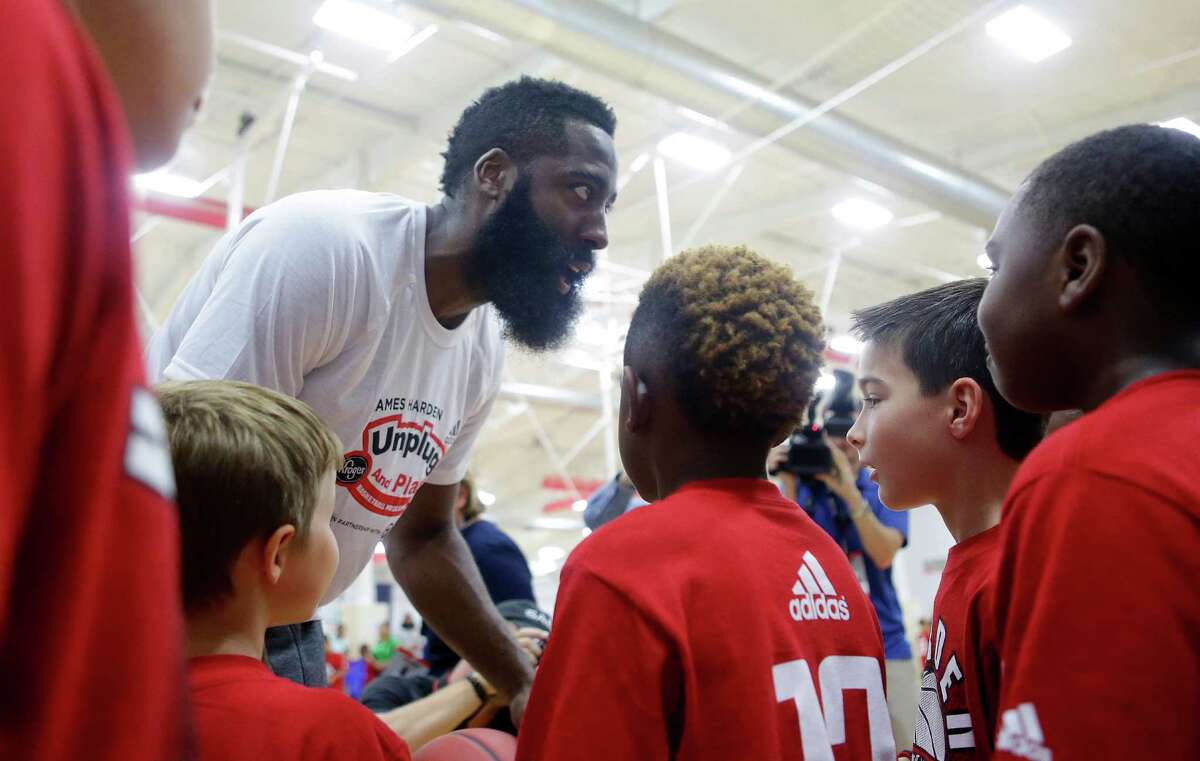 James Harden interacts with campers after team pictures at the James Harden Basketball ProCamp,Thursday, June 23, 2016, in Houston.