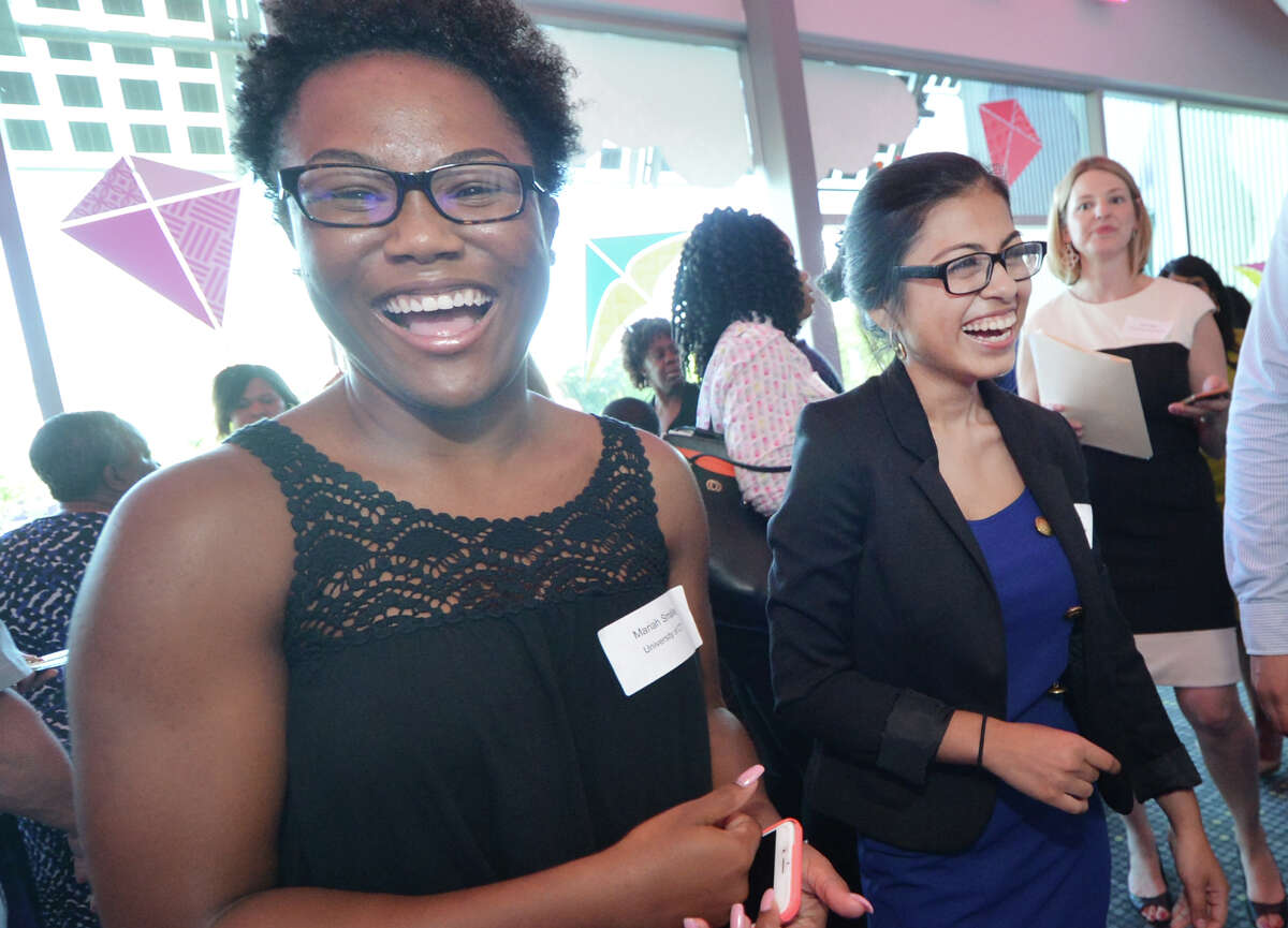 Mariah Smalls and Genesis Hernandez are all smiles as they are recipeints of a 2016 Norwalk Housing Foundation Undergraduate Scholarships, during the 18th Annual Scholarship Awards Ceremony at Stepping Stones Museum for Children on Wednesday June 22, 2016 in Norwalk Conn.