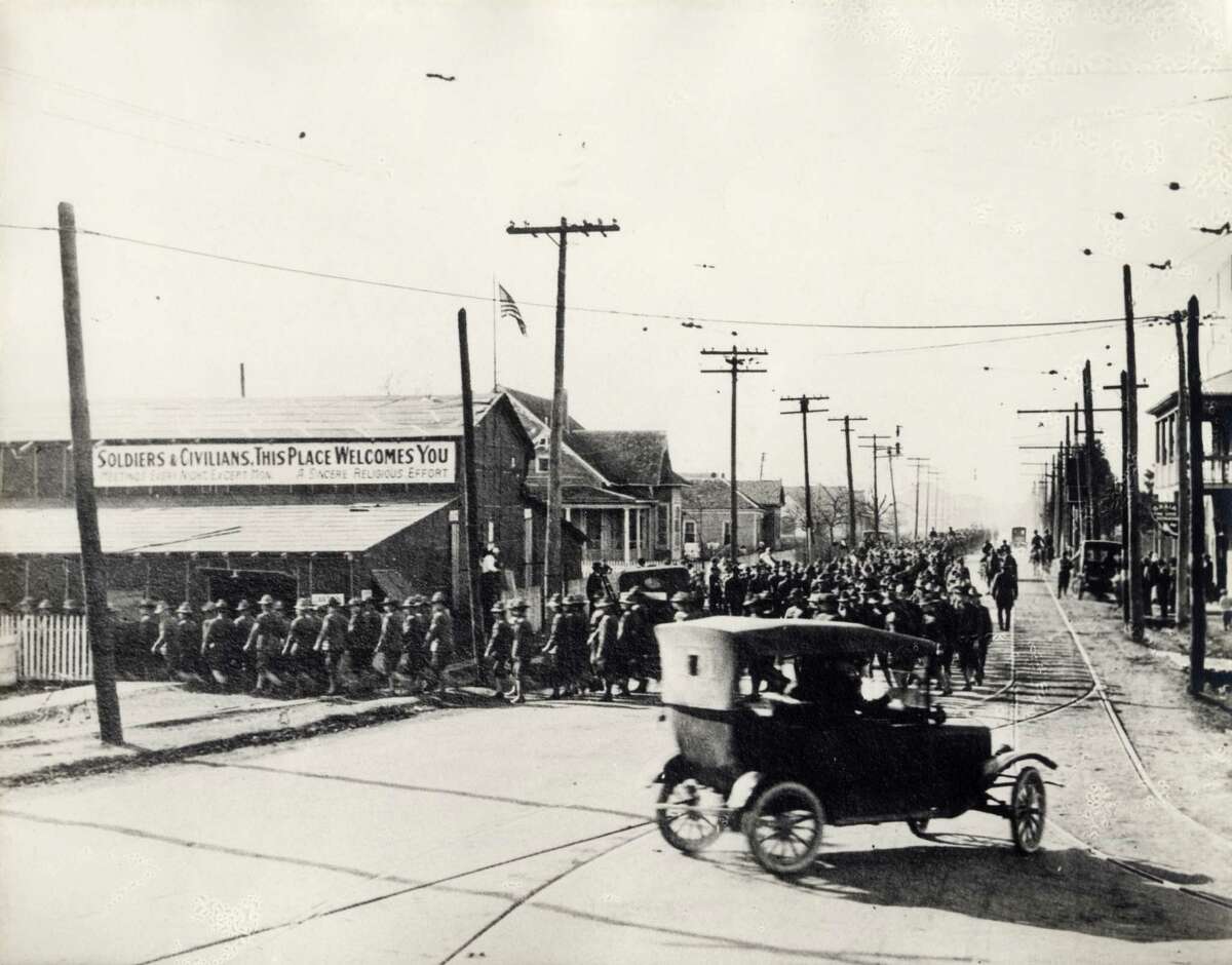 Soldiers marching near Camp Logan, the area now occupied by Memorial Park, in 1917.