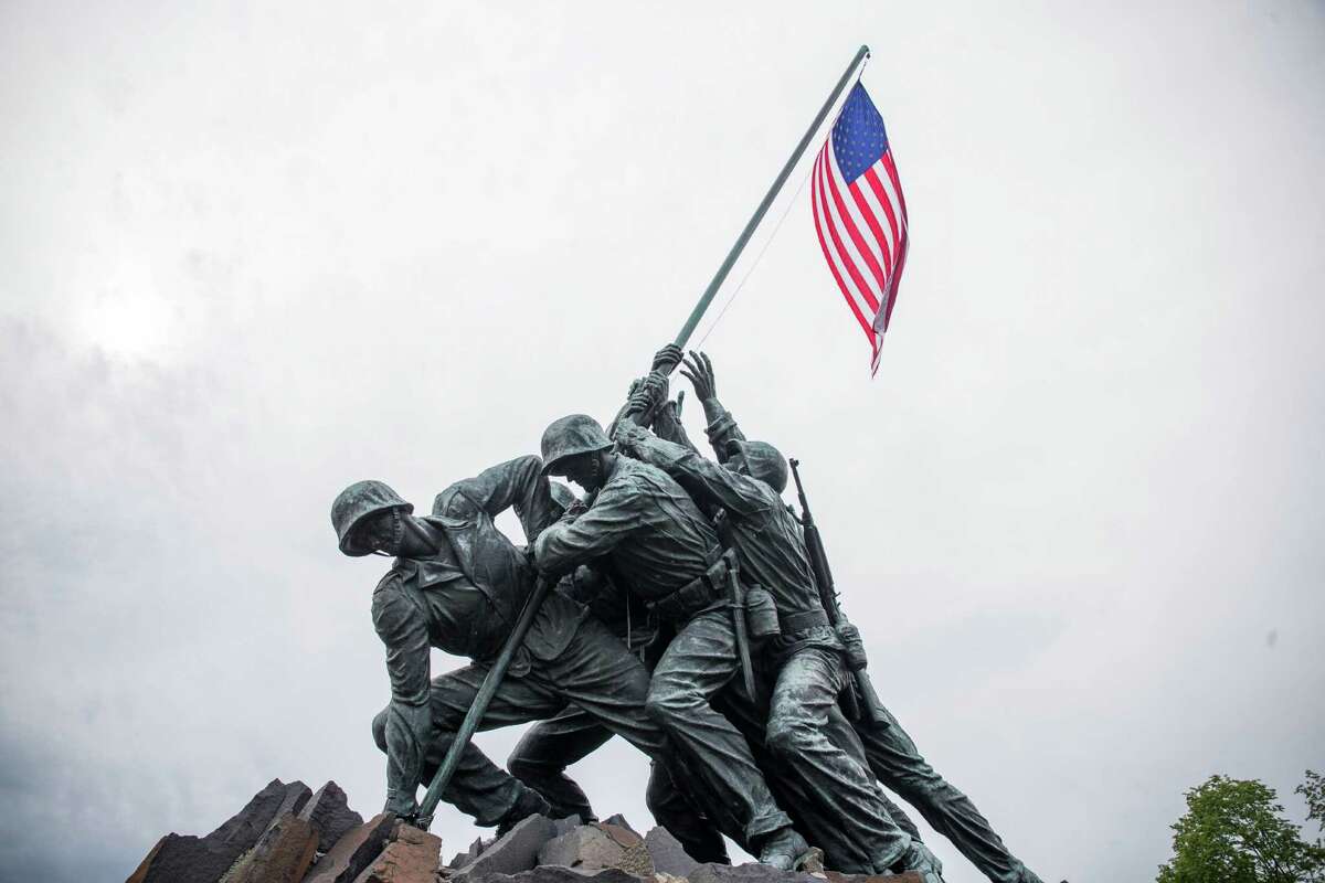The Marine Corps War Memorial depicts﻿ the raising of an American flag on Iwo Jima in World War II, in Arlington, Va.﻿ Pfc. Harold Schultz is the second soldier of the photo to be misidentified.﻿