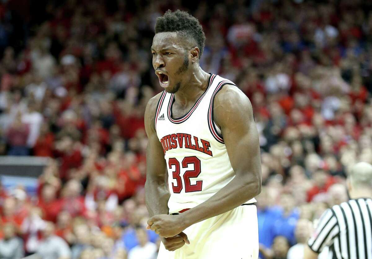 LOUISVILLE, KY - FEBRUARY 20: Chinanu Onuaku #32 of the Louisville Cardinals celebrates during the 71-64 win over the Duke Blue Devils at KFC YUM! Center on February 20, 2016 in Louisville, Kentucky.
