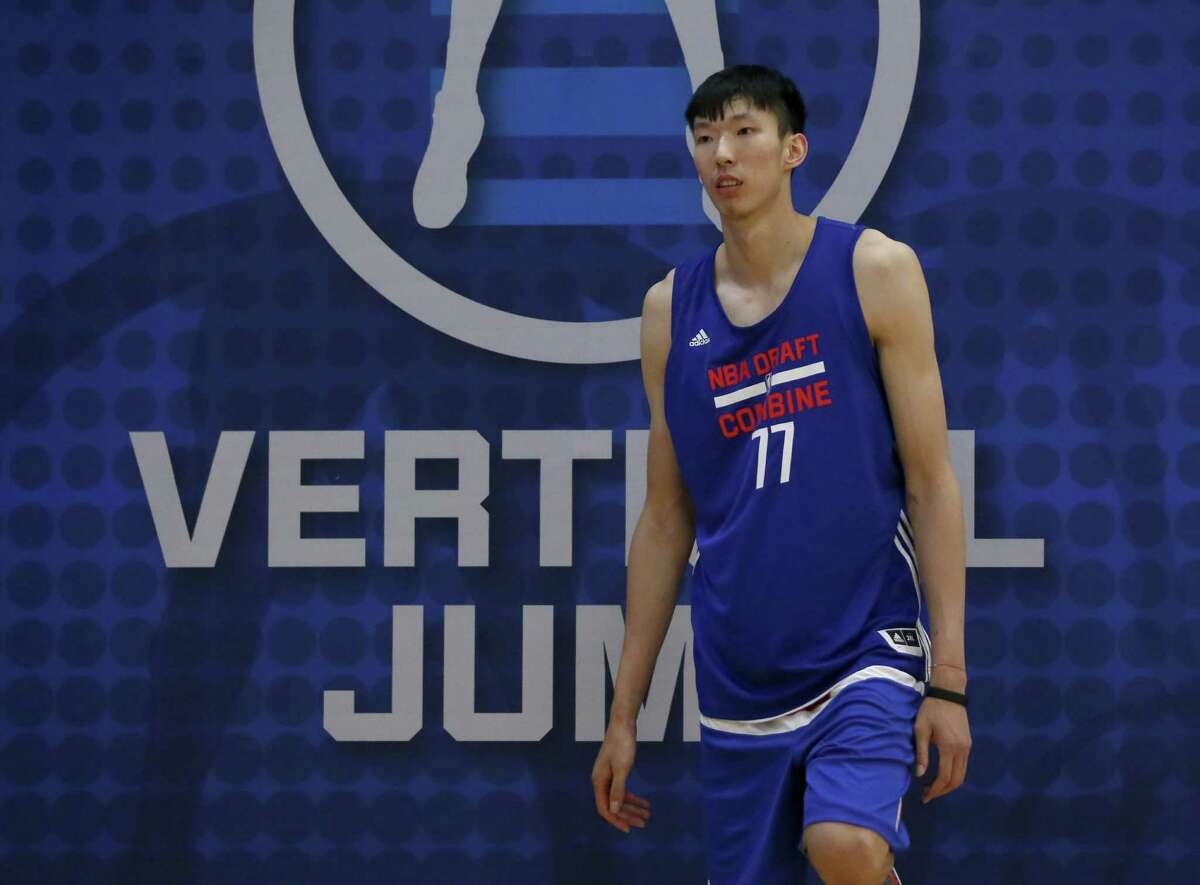 Zhou Qi, from China, participates in the NBA draft basketball combine Thursday, May 12, 2016, in Chicago. (AP Photo/Charles Rex Arbogast)