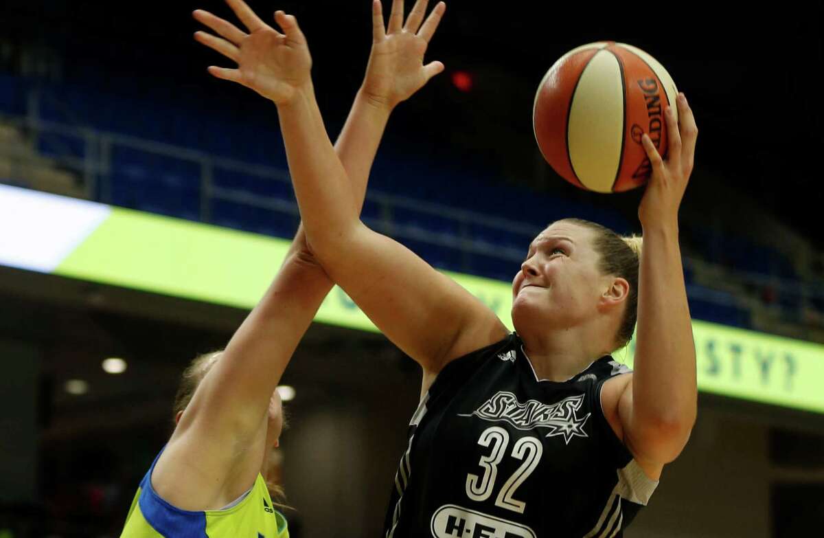 San Antonio Stars center Jayne Appel-Marinelli lays up a shot against Dallas Wings forward Theresa Plaisance during the second quarter of a WNBA game in Arlington on June 23, 2016.