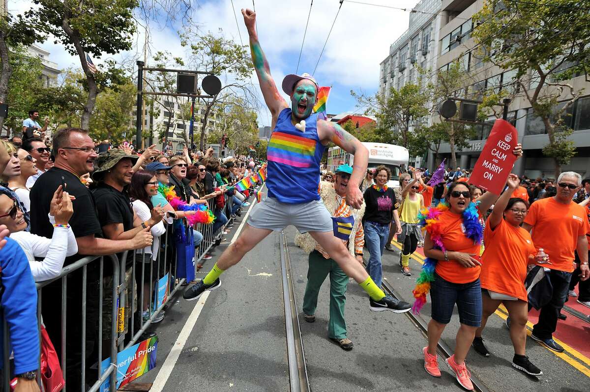 Benj Curtis jumps for joy during the annual Gay Pride Parade in San Francisco, California on June 28, 2015, two days after the US Supreme Court's landmark ruling legalizing same-sex marriage nationwide. AFP PHOTO / JOSH EDELSONJosh Edelson/AFP/Getty Images