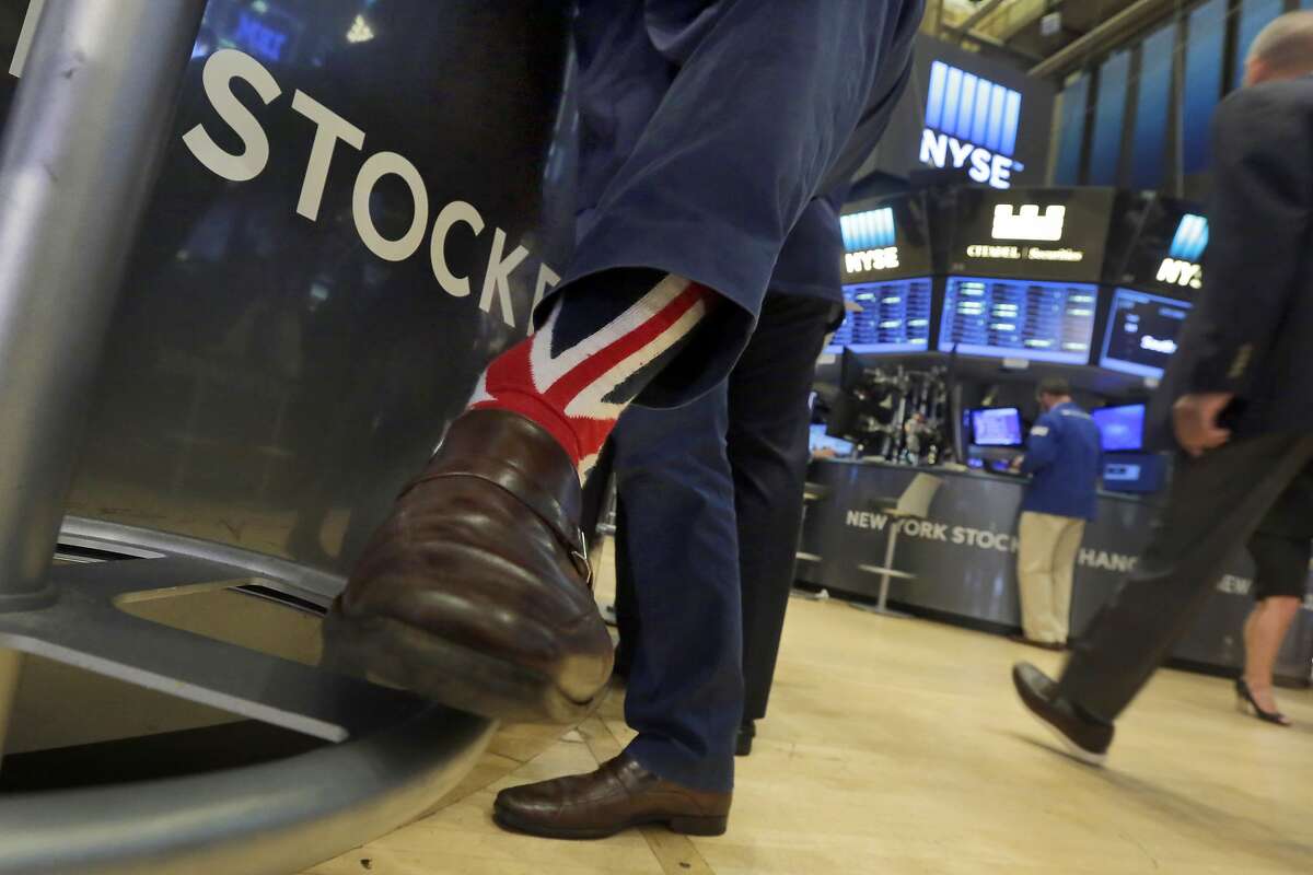 Specialist Michael Pistillo wears Union Jack socks as he works on the floor of the New York Stock Exchange, Friday, June 24, 2016. U.S. stocks are plunging in early trading after Britons voted to leave the European Union. (AP Photo/Richard Drew)