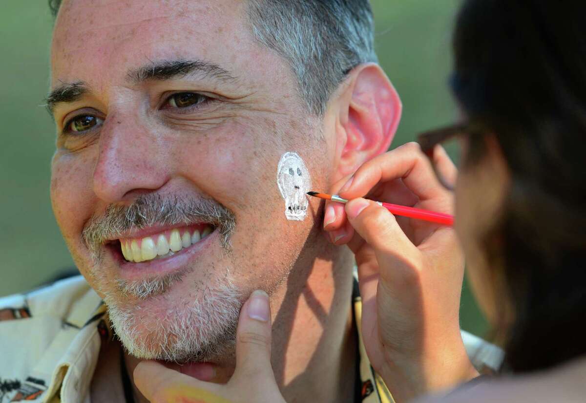 Shakespeare on the Sound Executive Producer Robert Levinstein gets a skull and bones face painting during Family Night! held before the company's main stage production of Hamlet at Pinkley Park on Rowayton Avenue in Norwalk, Conn. on Friday June 24, 2016. Before the main production, Shakespeare on the Sound campers from ages 9-13, performed Hamlet Jr., an abridged production of Hamlet for audience members as part of Family Night! Some of the other activities for kids included face painting with a Shakespearean theme and crafts at the First Folio Kids Corner. Performances will be held through July 3. Every evening at 7:30 p.m., except Mondays. Tuesday-Thursday, performances are free. On Fridays, Saturdays and Sundays admission is $20, $10 for seniors and children 13 and older. For more info call 203-299-1300, or visit www.shakespeareonthesound.org