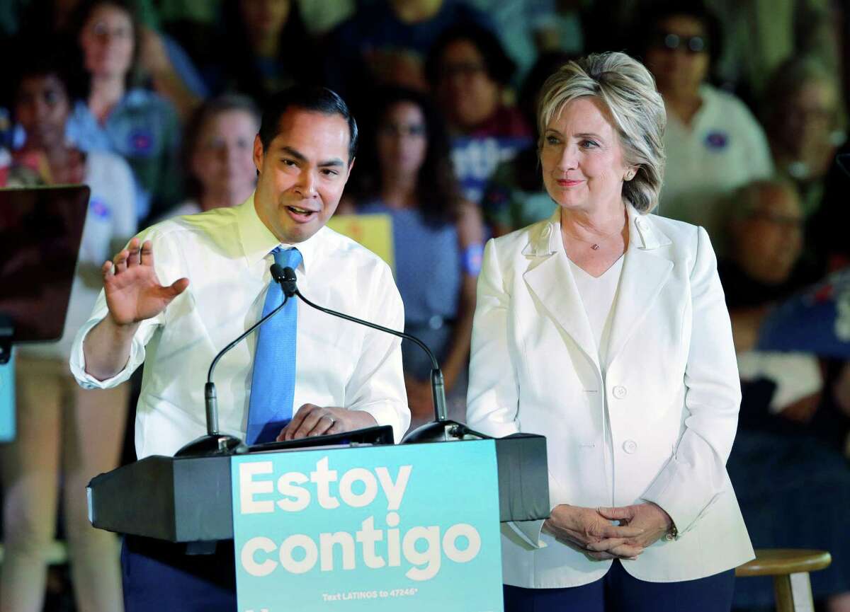 In this Oct. 15, 2015 file photo, Housing and Urban Development Secretary Julian Castro, left, speaks during a campaign event for Democratic presidential candidate Hillary Rodham Clinton, right, in San Antonio. Castro is returning home Friday, June 17, 2016, swarmed by the same speculation about whether he could be Hillary Clinton's running mate this fall. (AP Photo/Eric Gay, File)