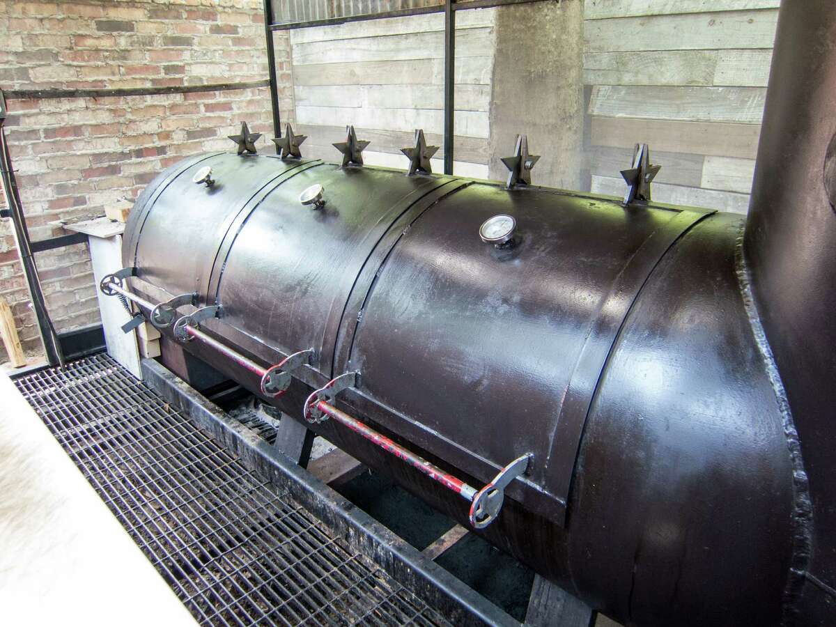 Tejas Chocolate Craftory's offset barrel smoker is mostly exposed to the elements.