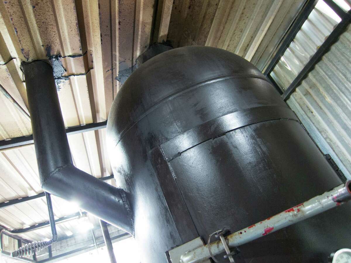 Vertical flues control airflow through the smoker at Tejas Chocolate Craftory in Tomball.