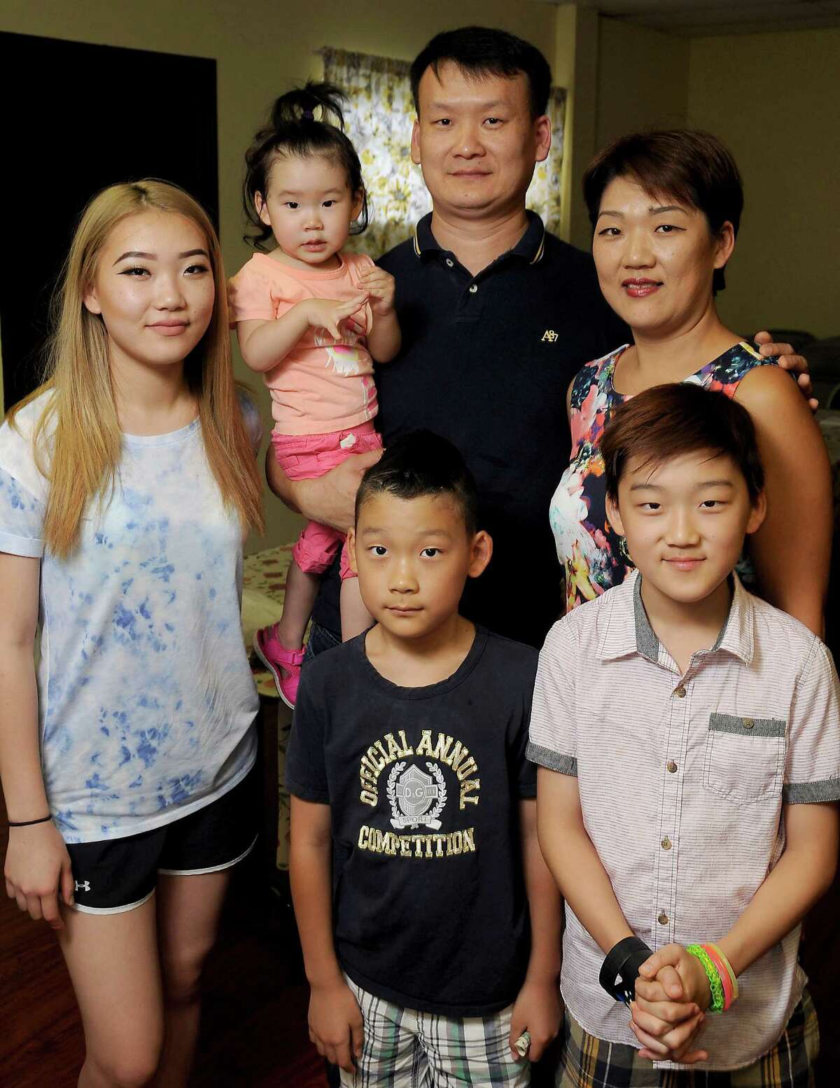 Viktor Lim with his wife Radmila and their children Grace,15, Elijah,10, Max,9 and Yuna,2, at their church Sunday June 19,2016.(Dave Rossman Photo)