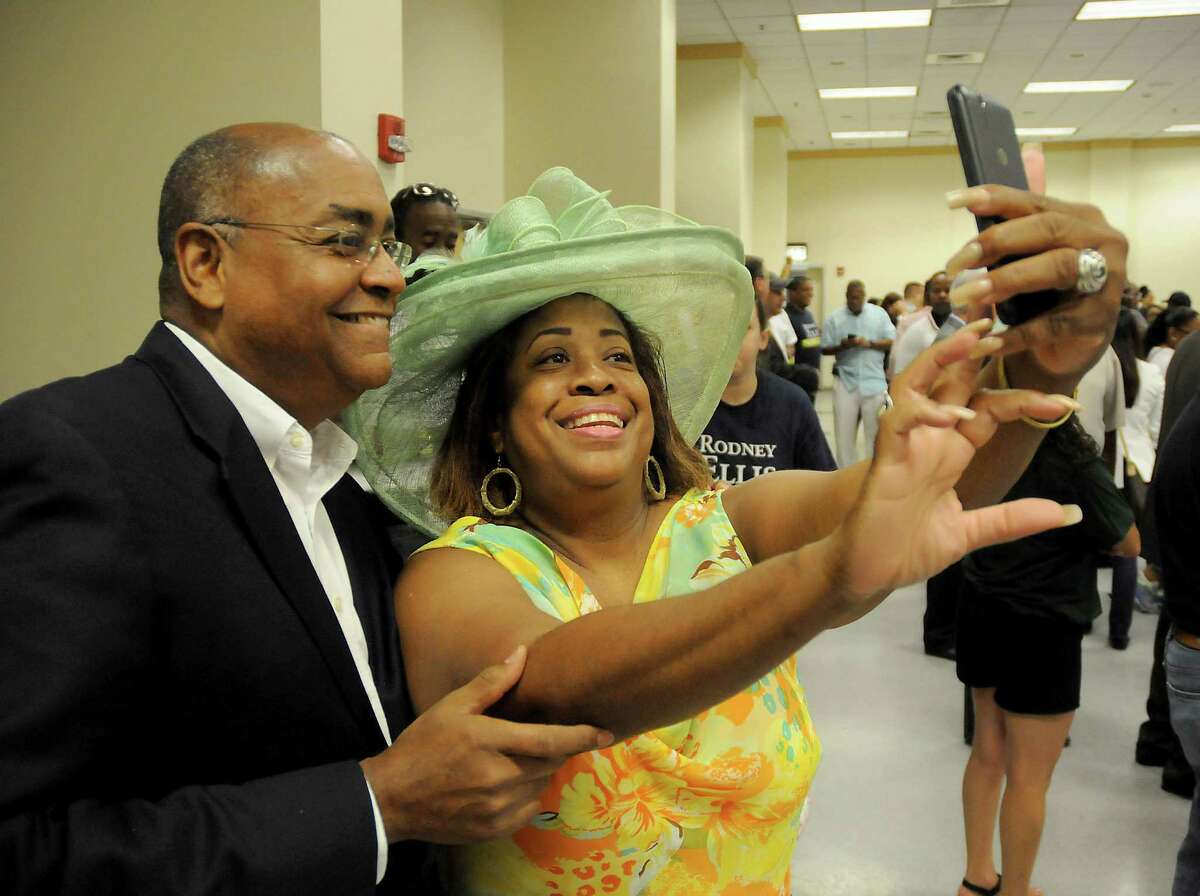Candidate Rodney Ellis takes a selfie with Nata Koerber before a meeting of Harris County Precinct 1 Chairs at CWA Local 6222 downtown Saturday June 25,2016.(Dave Rossman Photo)