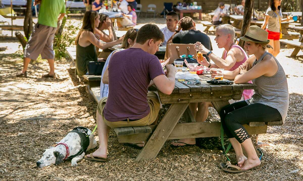 People have beers in the beer garden at the Alpine Inn in Portola Valley, Calif. on June 25th, 2016.