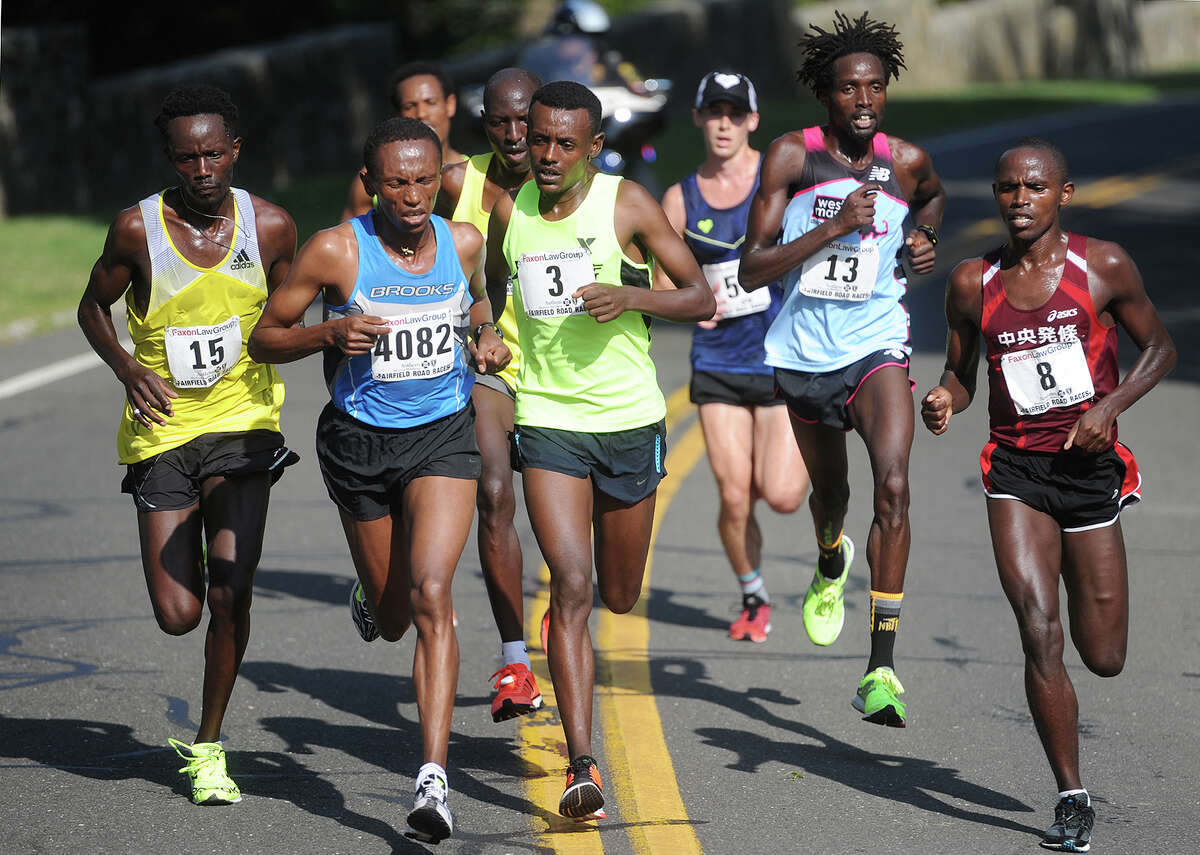 Elite runners compete in the lead pack during the 2016 Faxon Law Fairfield Half Marathon in Fairfield, Conn. on Sunday, June 26, 2016. Number 3, Tsegaye Getachw, center, of Ethiopia, was the eventual winner, breaking away with countryman number 4082, Ayele Megersa Feisa, in the second half of the race.