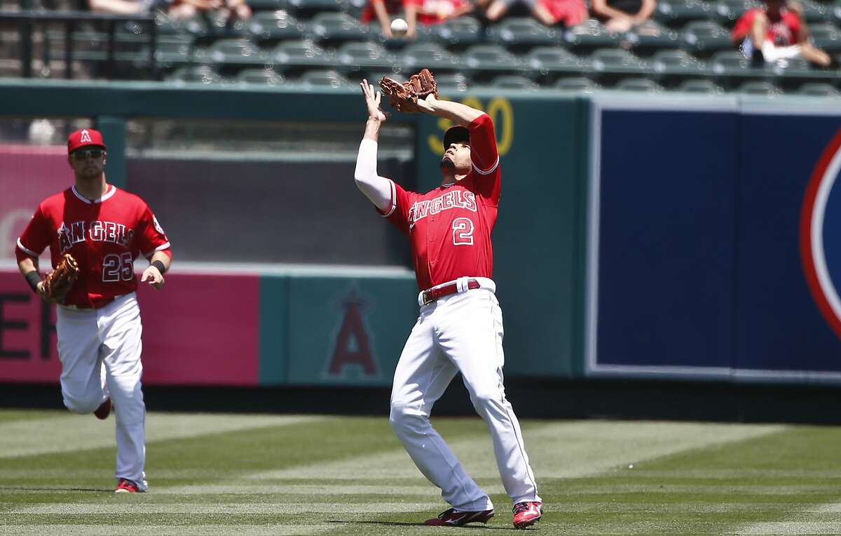 Los Angeles Angels shortstop Andrelton Simmons (2) gathers in a high pop fly in left field hit by Oakland Athletics' Billy Butler in the first inning of a baseball game Sunday June 26, 2016 in Anaheim, Calif. (AP Photo/Lenny Ignelzi)