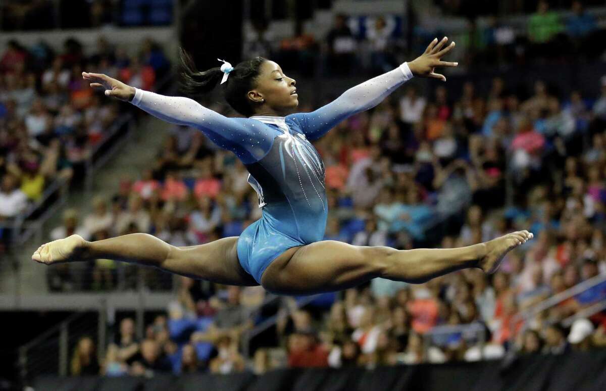 Simone Biles competes in the floor exercise during the U.S. women's gymnastics championships Sunday, June 26, 2016, in St. Louis. (AP Photo/Jeff Roberson)