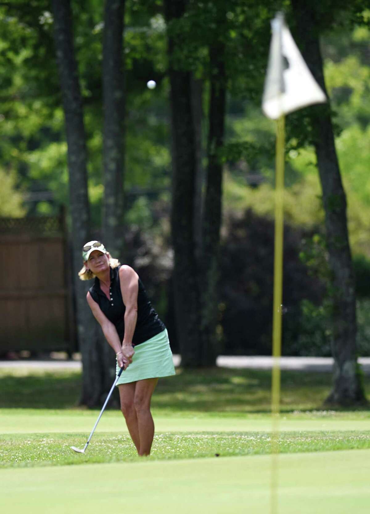 Pam Grunow chips onto the green during the Greenwich Ladies Town Golf Tournament at Griffith E. Harris Golf on Monday in Greenwich. Grunow won the townwide championship, shooting an 82.
