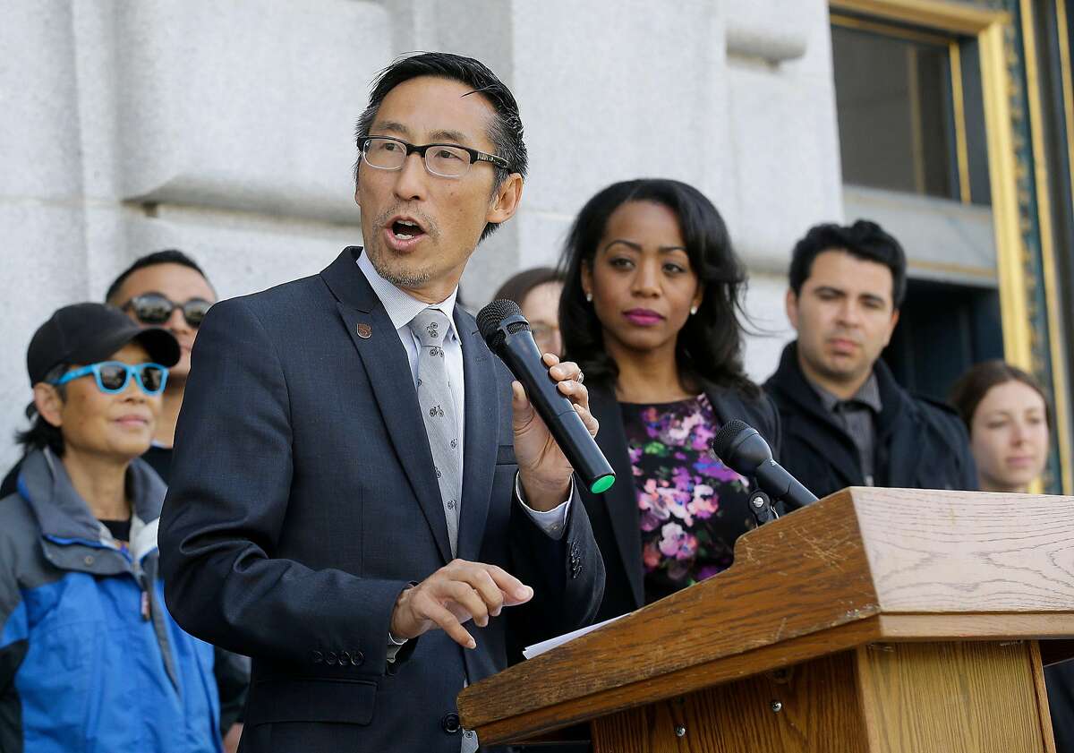 Supervisor Eric Mar, center left, speaks in front of Supervisor Malia Cohen during a news conference announcing that San Francisco backers of a tax on sugary beverages have enough signatures to put the measure on the November ballot ouside of City Hall in San Francisco, Thursday, May 12, 2016. This would be San Francisco's second attempt in two years trying to put a tax on the highly caloric drinks that some public health advocates say contributes to obesity. A 2014 attempt failed to garner the two-thirds approval needed for a dedicated tax. (AP Photo/Jeff Chiu)