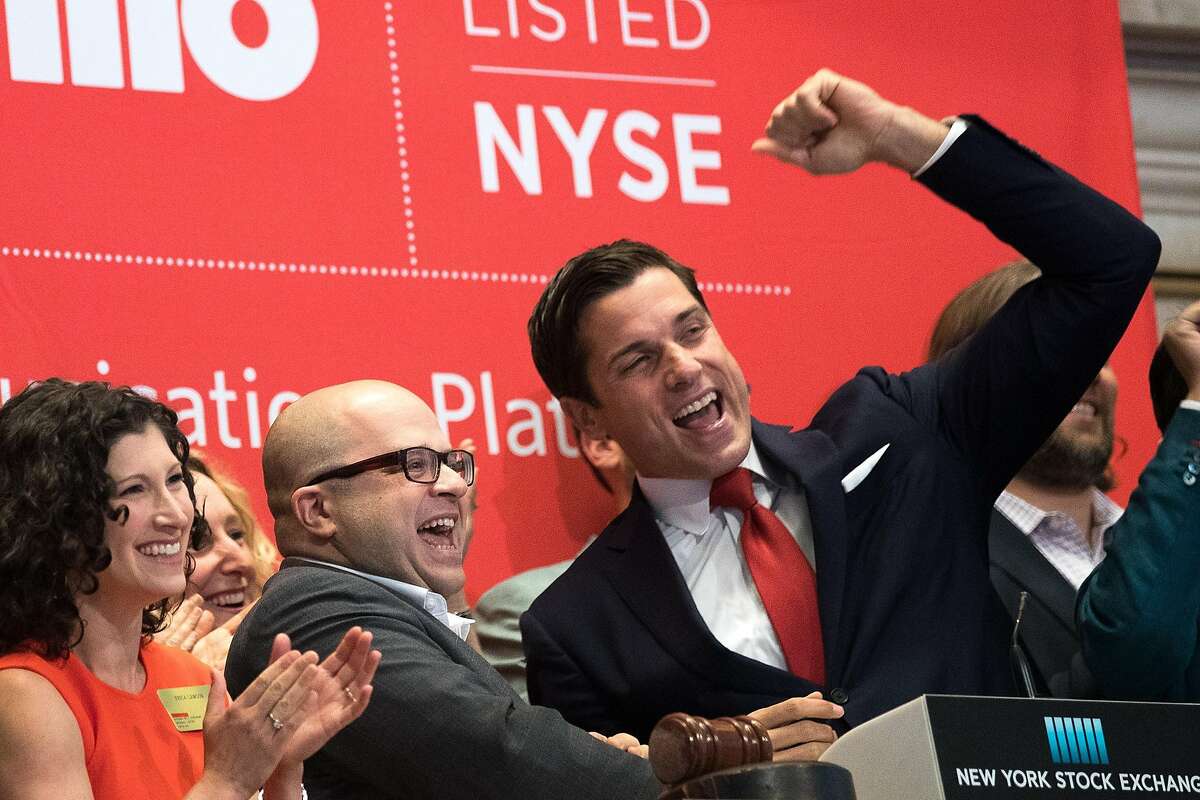 Twilio Inc. founder and CEO Jeff Lawson (center) reacts after ringing the opening bell to celebrate Twilio's initial public offering, at the New York Stock Exchange, June 23, 2016, in New York City.