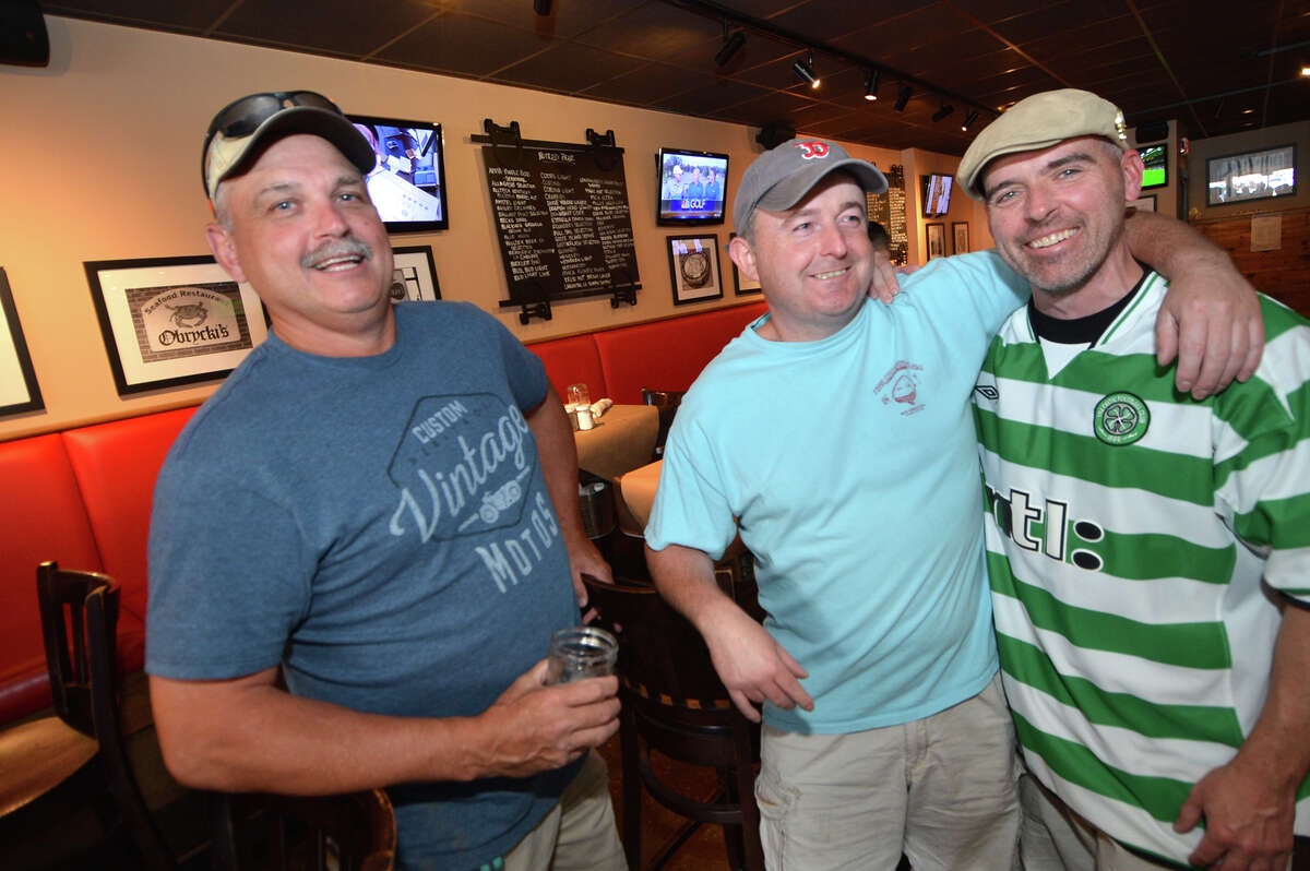 Yankees fan Frank Riehl, and Red Sox fan Eddie McAleese with Yankees fan Brendan Herlihy, enjoy an afternoon of watching baseball and sports like the Euro Cup soccer at Banc House on Sunday in Norwalk.