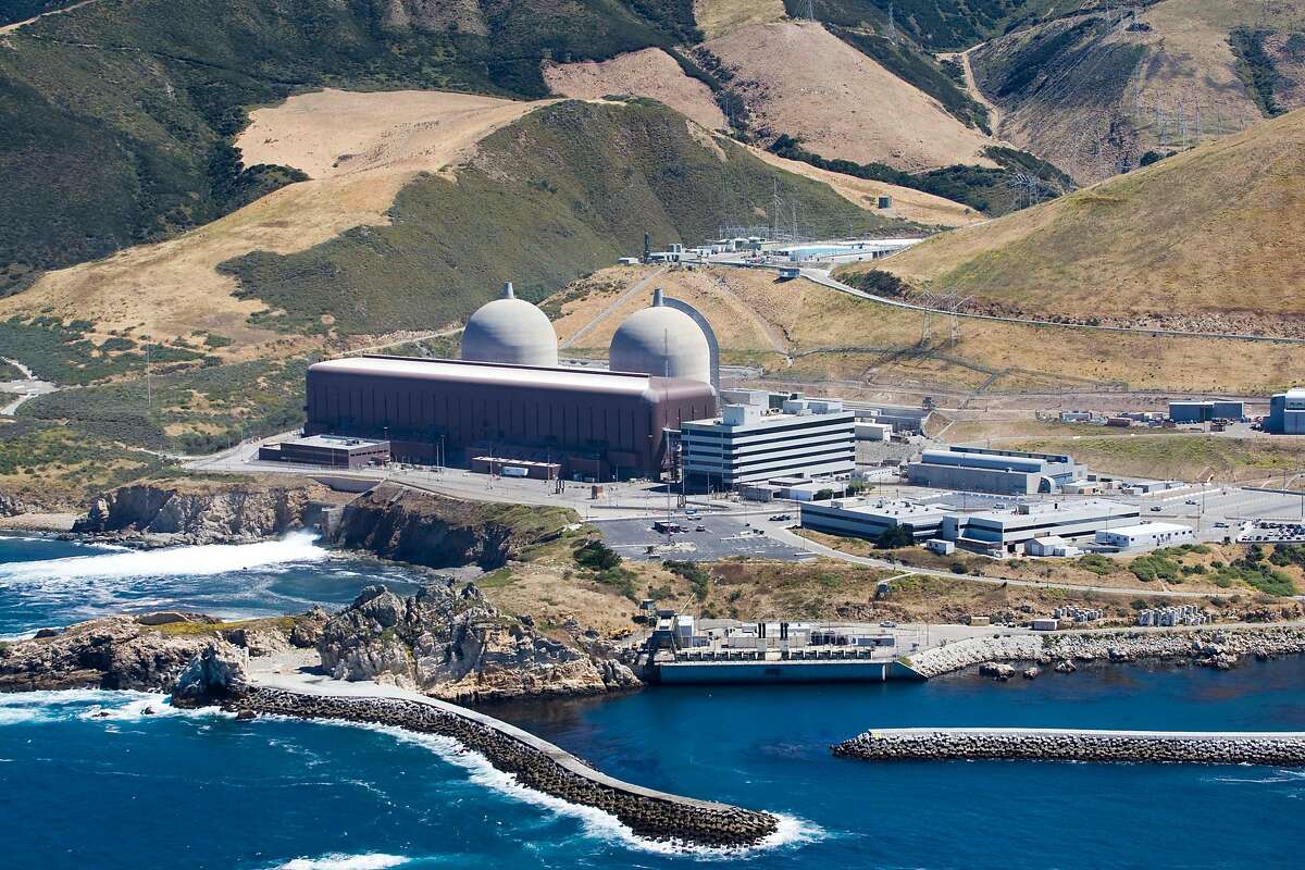 FILE - This aerial file photo taken, June 20, 2010, shows the Diablo Canyon Nuclear Power Plant, in Avila Beach, Calif. California regulators are expected to decide Tuesday, June 28, 2016, whether to drop their longstanding environmental objections to the state's last nuclear power plant in return for its promised early closing. (Joe Johnston/The Tribune (of San Luis Obispo) via AP, File) MANDATORY CREDIT