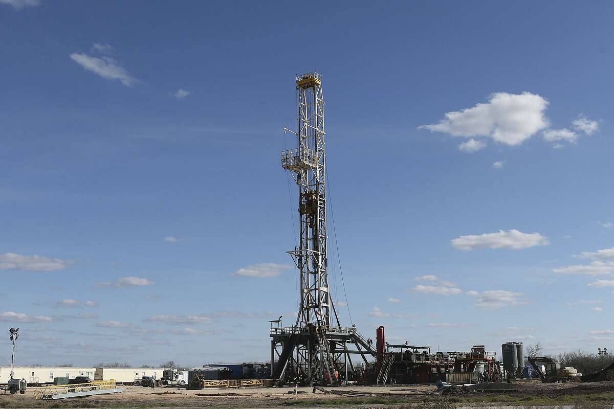 Work continues on a drilling rig off Texas State Highway 72 east of Tilden, Texas, Thursday, February, 19, 2015. The Permian Basin oil field in West Texas and Eagle Ford Shale oil field in South Texas both gained one drilling rig last week, according to the service company Baker Hughes.