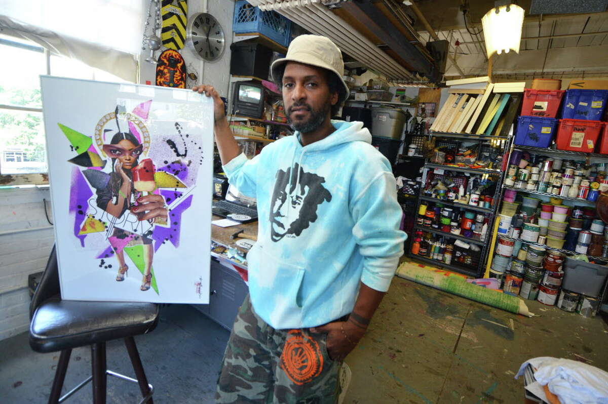 Visual artist Jahmane West with his mixed-media collage titled “Storm Trooper” at Firing Circuits Studios in Norwalk.