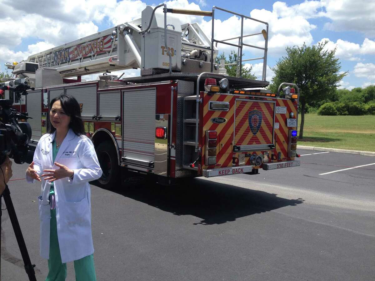 Dr. Lillian Liao, of the University of Texas Health System, talking to local reporters about the danger of leaving children in hot cars in the Texas heat. Liao said that even in 80-degree weather, it’s only a matter of minutes before the heat starts affecting a child stuck in a car.