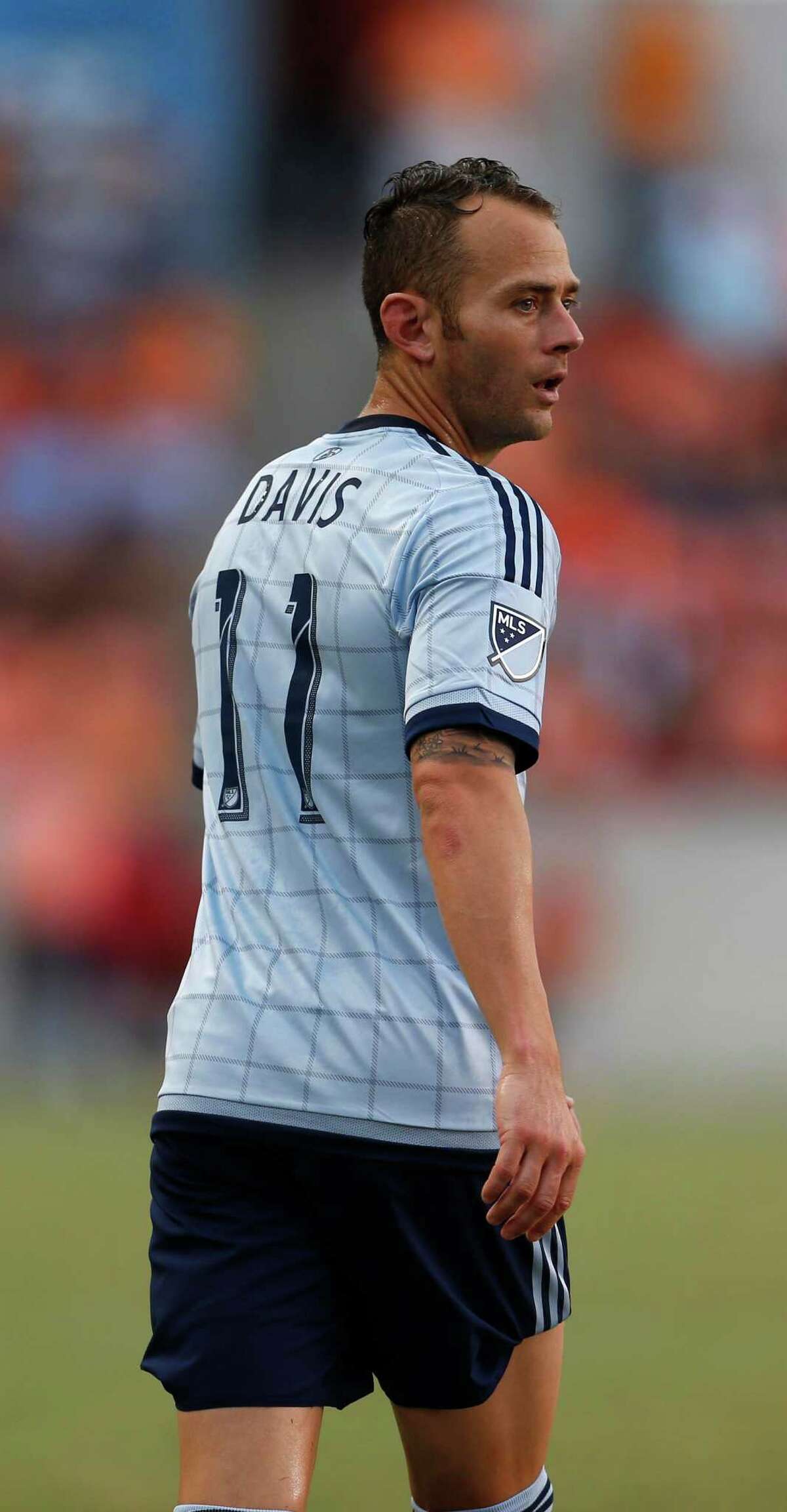 Former Houston Dynamo traded to Kansas City, midfielder Brad Davis will sign a one-day contract and officially retire wearing a Dynamo jersey. 