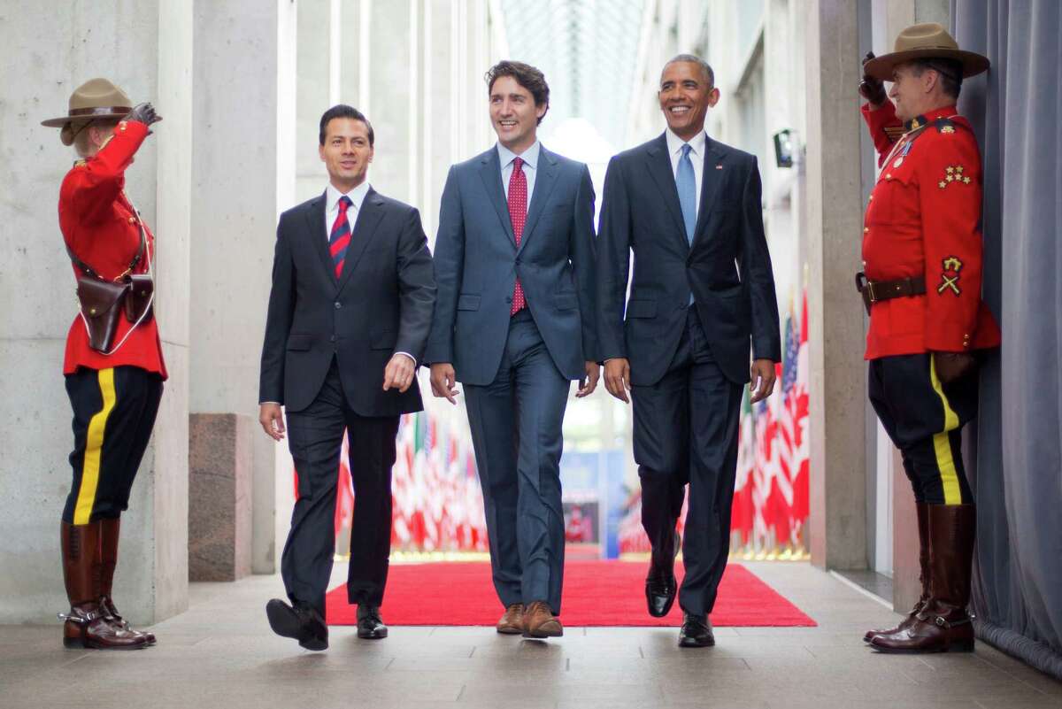 President Barack Obama walks with Canadian Prime Minister Justin Trudeau and Mexican President Enrique Pena Neito at the National Gallery of Canada in Ottawa, Canada, Wednesday, June 29, 2016. Obama traveled to Ottawa for the North America Leaders' Summit. (AP Photo/Pablo Martinez Monsivais) ORG XMIT: CANM110