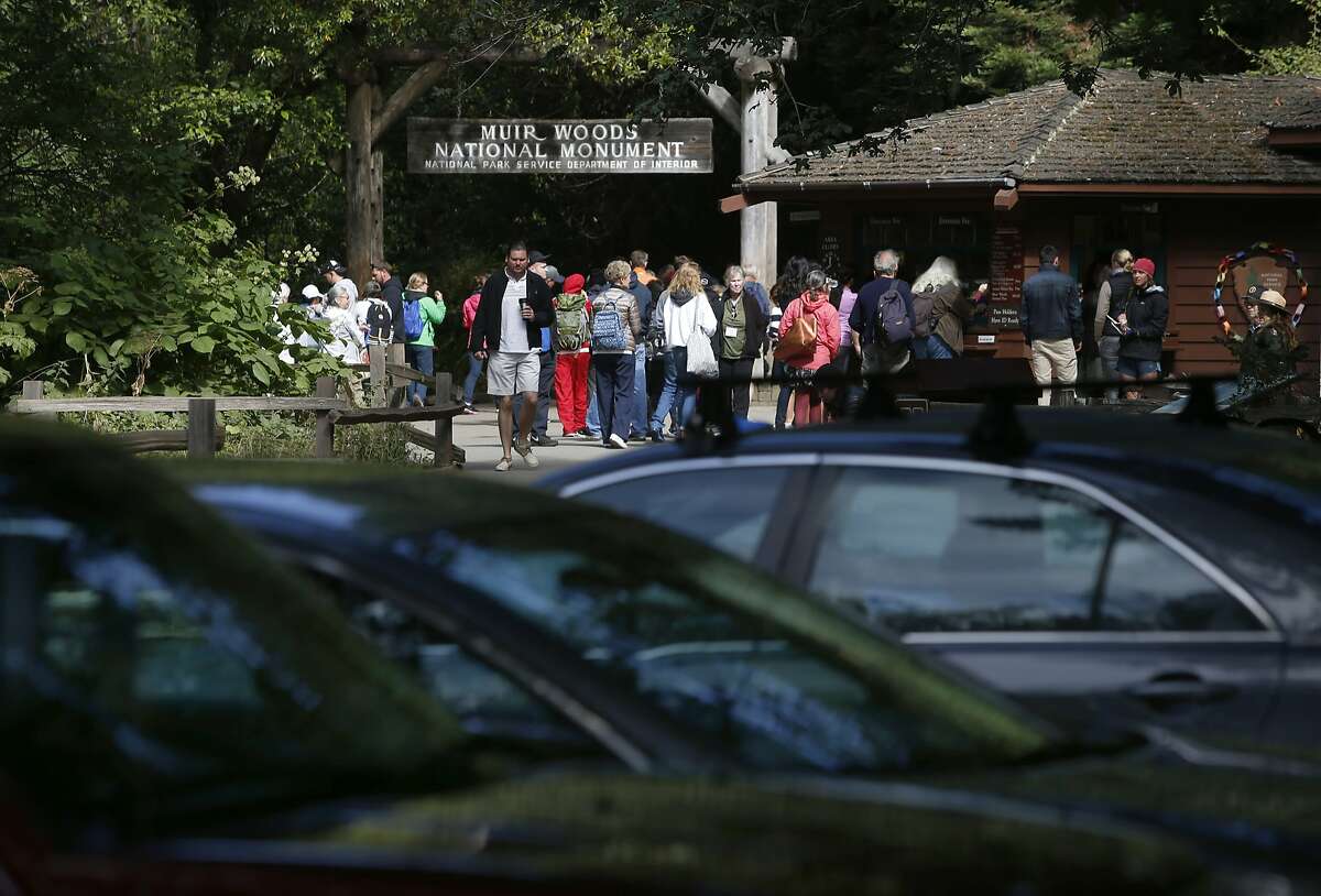Visitors line up to pay the entrance fee at Muir Woods National Monument in Mill Valley, Calif. on Wednesday, June 29, 2016. The National Park Service is considering a plan to remove a parking lot and reduce a wide pedestrian area at the entrance to the park and restore the natural habitat along nearby Redwood Creek.