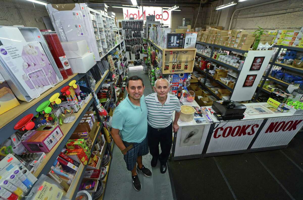 Cook's Nook owners, Sanjay Dipchand and father Gobind Dipchand at their longtime location at 465 Connecticut Avenue in Norwalk, Conn. Tuesday, June 28, 2016. After 18 years Cooks Nook has been forced out from its to make way for a Chick Fil A franchise and will relocate in Wilton at Danbury Road.