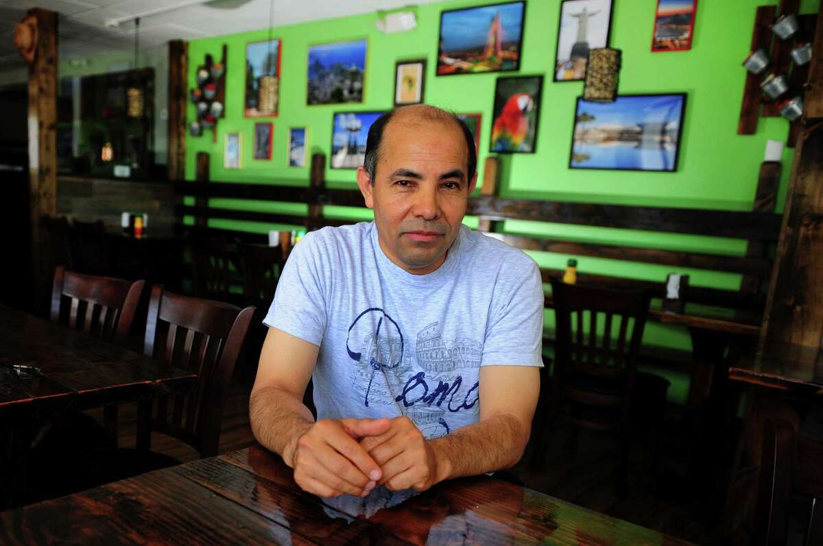 Owner Manny Olivares poses at Rancho Pantanal, a new Brazilian restaurant which opens Friday on Boston Post Road in Bridgeport, Conn., on Wednesday June 29, 2016.