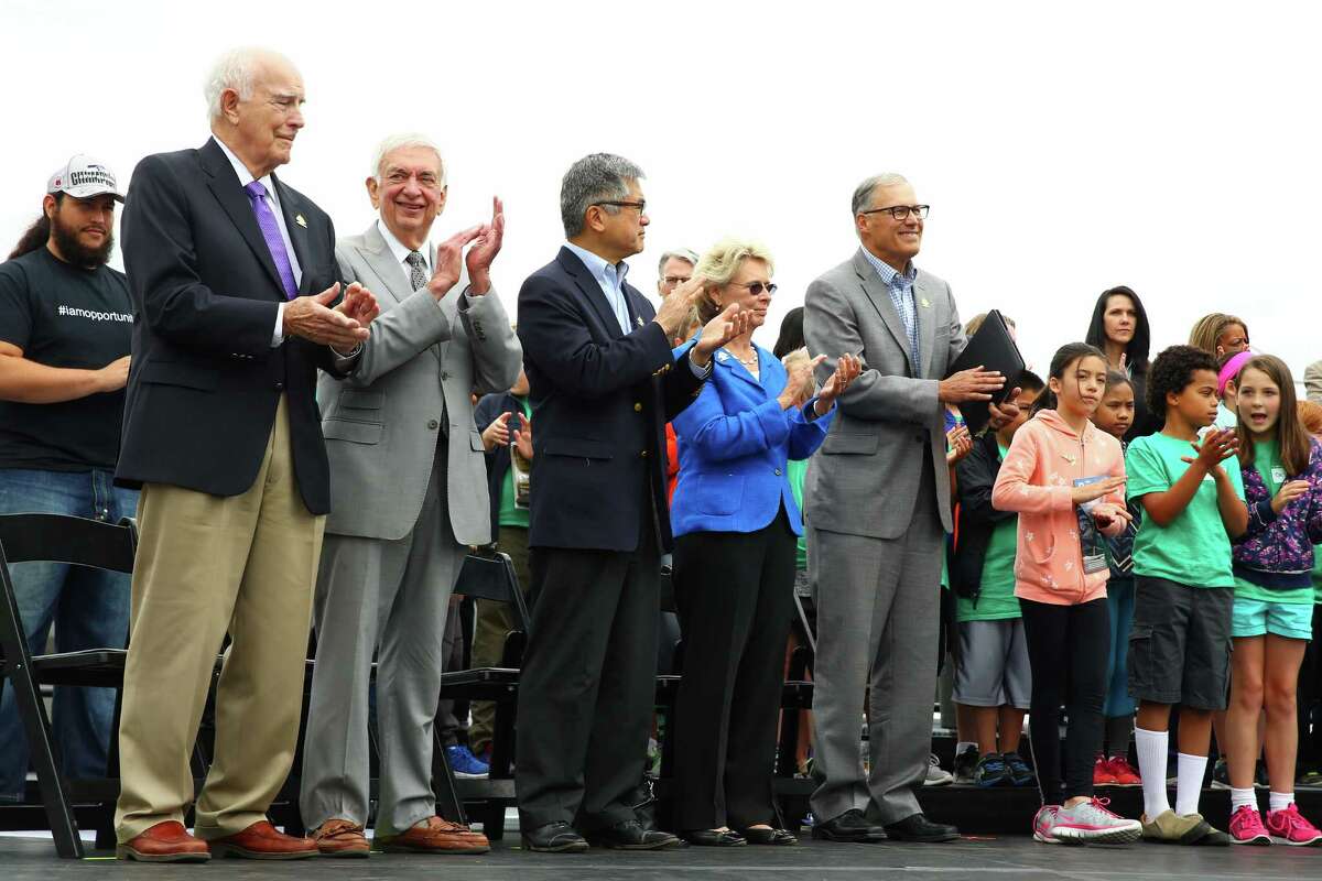 Five Washington State governors including, from left, Dan Evans, Mike Lowry, Gary Locke, Christine Gregoire, and Jay Inslee stand on stage during a kickoff celebration for Boeing's 100th anniversary month, Thursday, June 30, 2016 at the Museum of Flight.