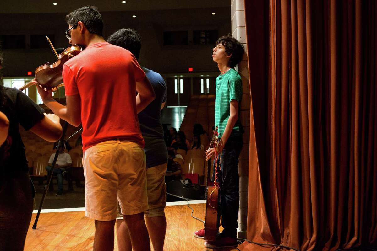David Cantu, 15, waits to get into position to perform alongside his fellow classmates, all area high school students, at the conclusion of the second annual SAISD Summer Mariachi Camp at Burbank High School in San Antonio, on Thursday, June 30, 2016.