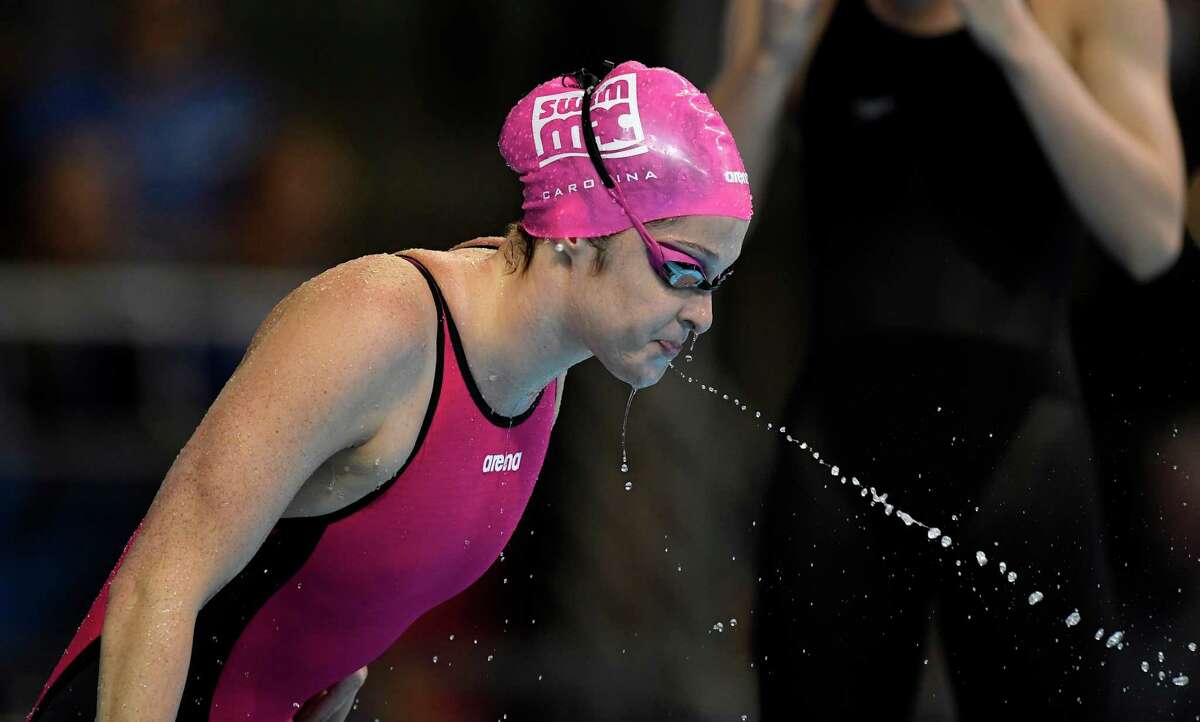 Cammile Adams spits before swimming in the women's 200-meter butterfly final at the U.S. Olympic swimming trials, Thursday, June 30, 2016, in Omaha, Neb. Adams won the race(AP Photo/Mark J. Terrill)