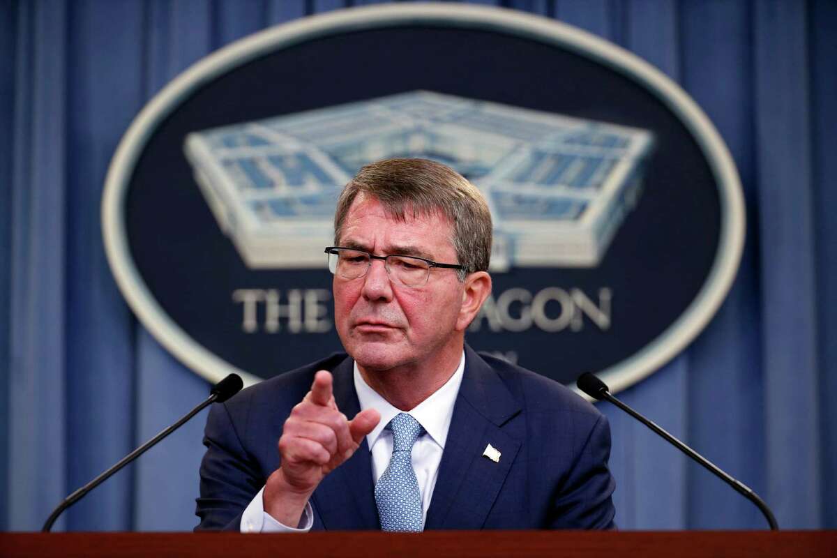 Defense Secretary Ash Carter points to a questioner during a news conference at the Pentagon, Thursday, June 30, 2016, where he announced new rules allowing transgender individuals to serve openly in the U.S. military. (AP Photo/Alex Brandon)