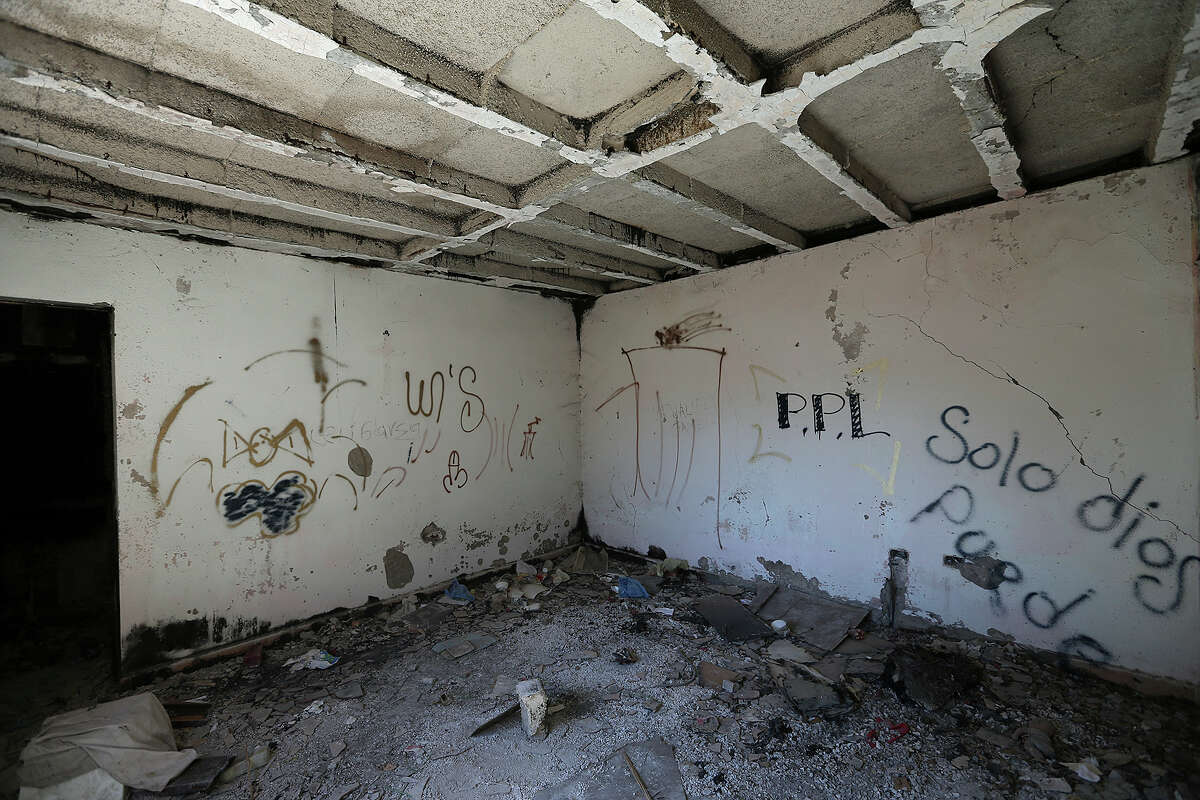 A burned-out house lies in ruins in the the town of Allende, Mexico, Tuesday, Jan. 27, 2015. Allende is a small town southwest of Piedras Negras, Mexico and is the site of a massacre by the drug cartel, Los Zetas. It is estimated that over 300 went missing or killed and several homes destroyed in March of 2011. Over 25,000 are considered missing in Mexico through the end of 2014.