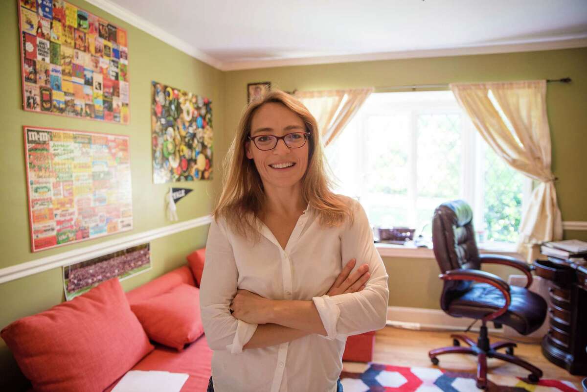 Novelist Wendy Walker in her home in Stamford. Oscar-winning actress-producer Reese Witherspoon has bought the movie rights to her latest book, “All Is Not Forgotten.”