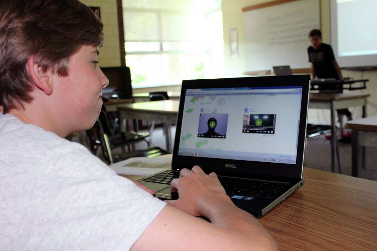 James, 13, gets ready to view a message from Rahul, his global partner.