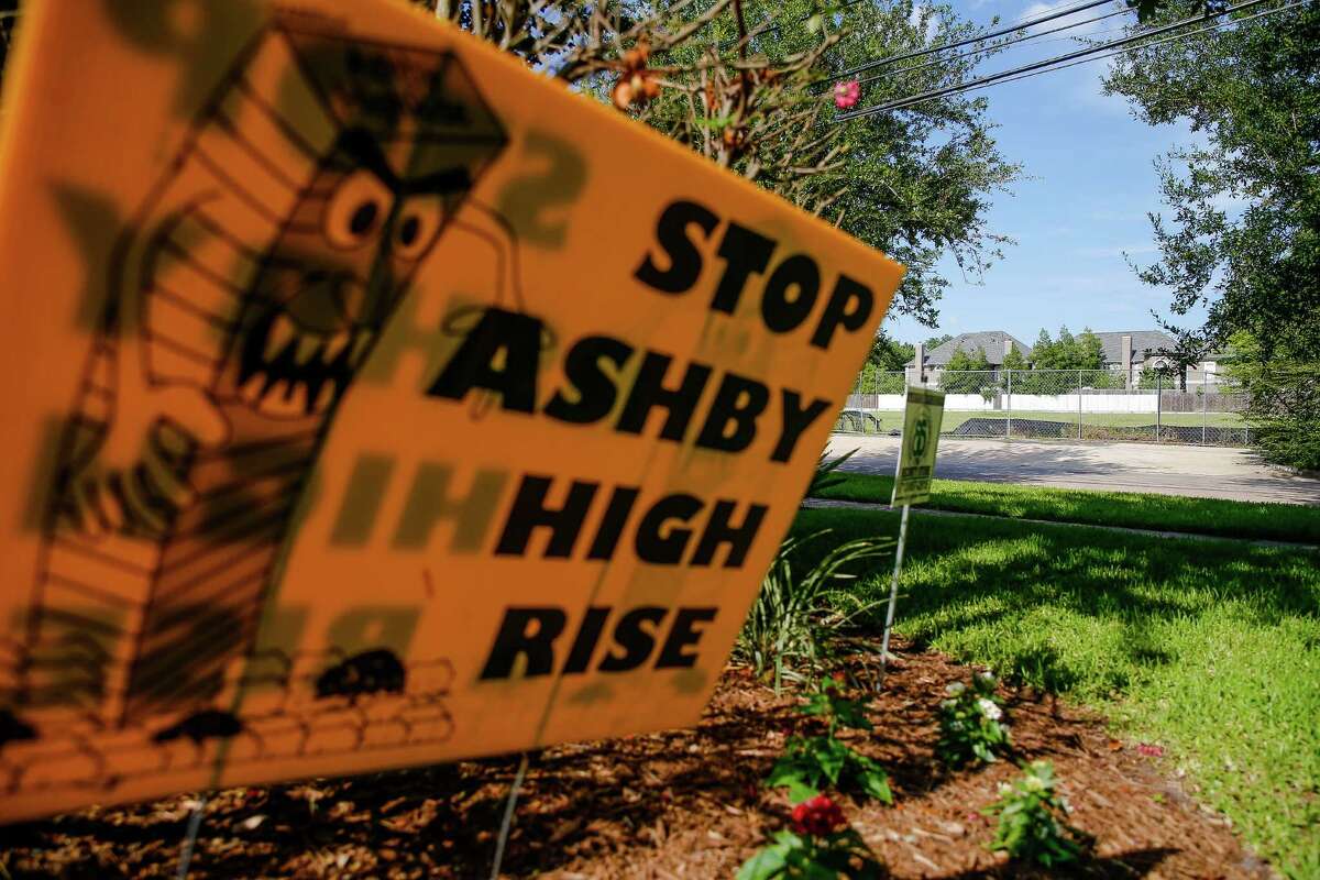 A "Stop Ashby High Rise" sits in the lawn of a home across the street from the proposed residential tower in a neighborhood near Rice University Friday, July 1, 2016 in Houston. A state appellate court has reversed a portion of the 2014 judgment that would have required developers of the high-rise to pay damages to residents in the neighborhood should they build the controversial residential tower. ( Michael Ciaglo / Houston Chronicle )