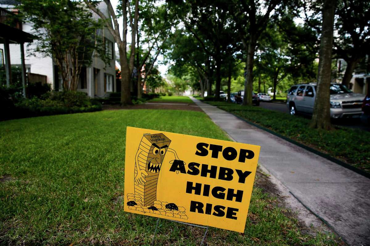 A "Stop Ashby High Rise" sits in the lawn of a home near the proposed residential tower in a neighborhood near Rice University Friday, July 1, 2016 in Houston. A state appellate court has reversed a portion of the 2014 judgment that would have required developers of the high-rise to pay damages to residents in the neighborhood should they build the controversial residential tower. ( Michael Ciaglo / Houston Chronicle )
