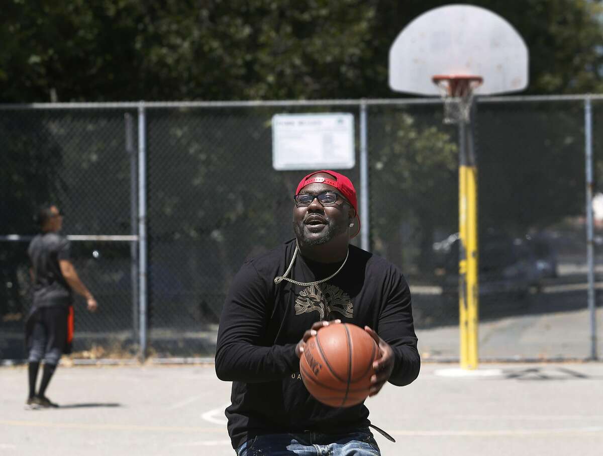 Rapper Mistah F.A.B. shoots hoops at Linden Community Park, where he spent his days as a youth, in Oakland, Calif. on Wednesday, June 29, 2016.