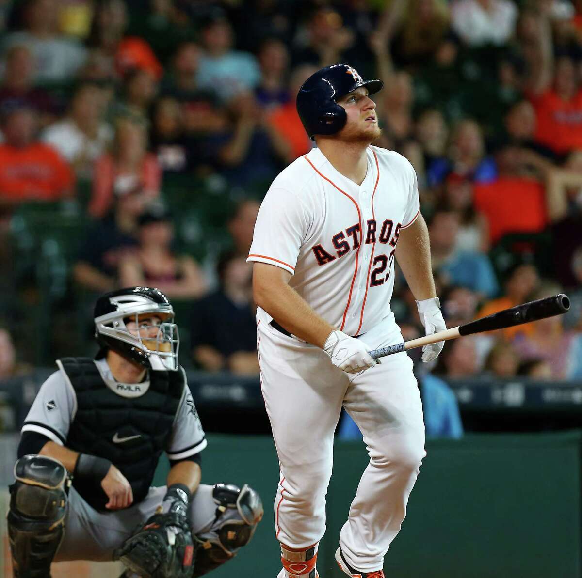 Houston Astros first baseman A.J. Reed (23) watches his home run, the first of his major league career, go over the outfield wall during the ninth inning of an MLB game at Minute Maid Park, Saturday, July 2, 2016, in Houston.