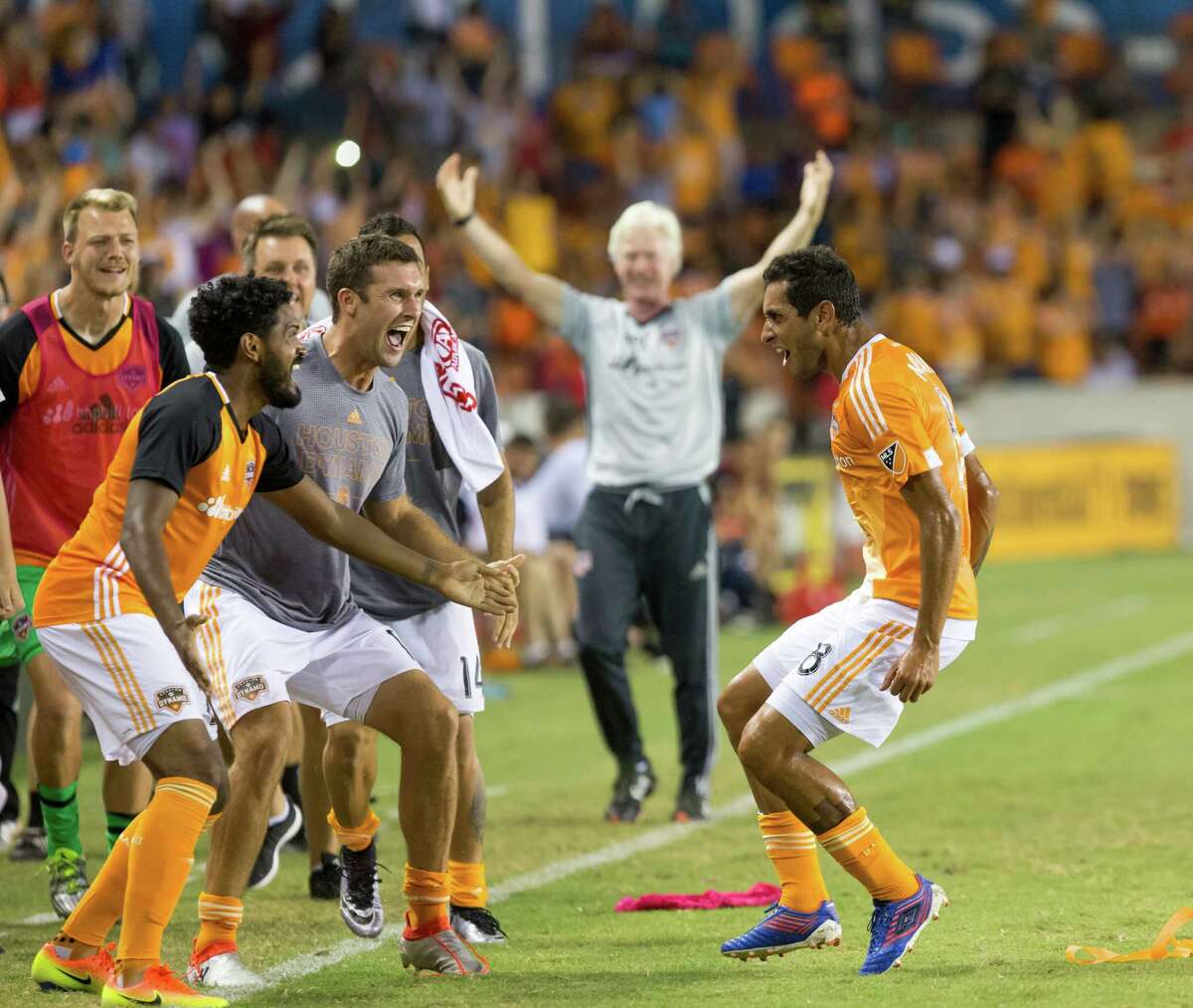 Houston Dynamo midfielder Cristian Maidana (8) celebrates with teammates after scoring in the free kick during the second half of action between the between the Houston Dynamo and the Philadelphia Union during an MLS soccer game at BBVA Compass, Saturday, July 02, 2016, in Houston. Houston Dynamo defeated Philadelphia Union 1-0. (Juan DeLeon/for the Houston Chronicle )