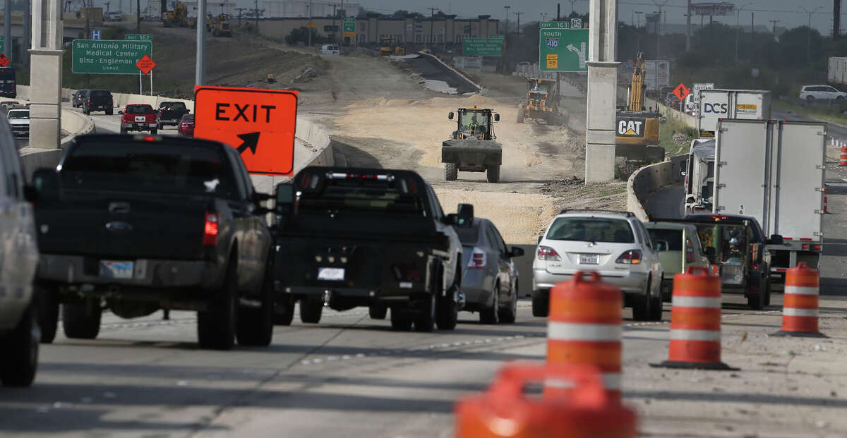 FILE - Construction-caused traffic backs up on July 3, 2016, where southbound Loop 410 splits off of southbound Interstate 35 in San Antonio. President Donald Trump's plan to invest $1 trillion in U.S. infrastructure hit a speed bump in the Lone Star State after the Texas House voted on May 5 to reject a bill that would have allowed public-private partnerships to participate in 18 highway projects costing as much as $30 billion.Click ahead for a recap of President Trump's first 100 days in office.