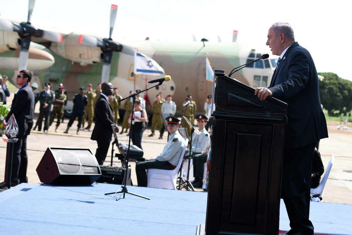 Israeli Prime minister Benjamin Netanyahu, gives a speech after his arrival at Entebbe airport Uganda, Monday, July 4, 2016. Netanyahu is on a four-nation Africa tour to Uganda, Kenya, Rwanda and Ethiopia. (AP Photo/Stephen Wandera)