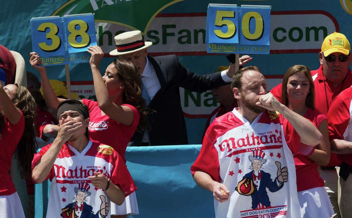 Matt Stonie, left, and Joey Chestnut compete in Nathan's Famous Fourth of July International Hot Dog Eating Contest men's competition, Monday, July 4, 2016, in New York. Chestnut came in first eating 70 hot dogs and buns in 10 minutes. Stonie came in second eating 53 hot dogs and buns in 10 minutes. (AP Photo/Mary Altaffer) ORG XMIT: NYMA109