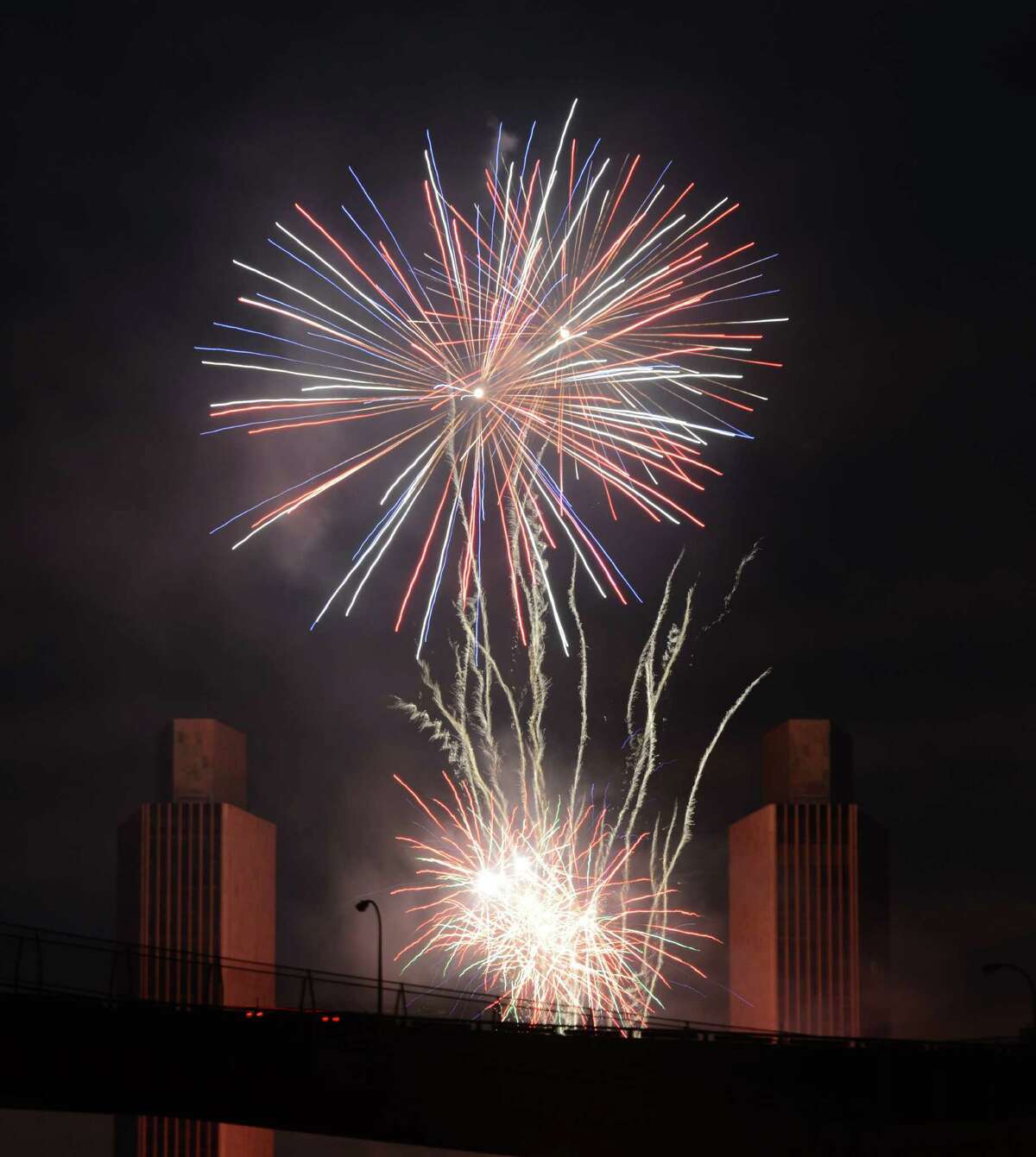 Fireworks fill the sky over Albany during New York States Fourth of July Celebration presented by Price Chopper & Market 32 at the Empire State Plaza on Monday night, July 4, 2016, viewed from Rensselaer, N.Y. (Will Waldron/Times Union)